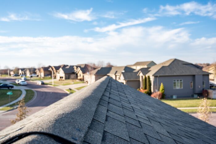 View of neighborhood rooftops highlighting residential roofs for insurance claims and repair evaluations.